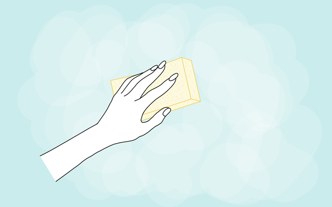 Dessin d'une main qui ponce un mur bleu