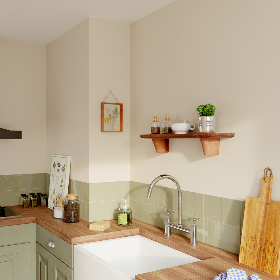 Cuisine avec crédence et meuble de couleur vert sauge