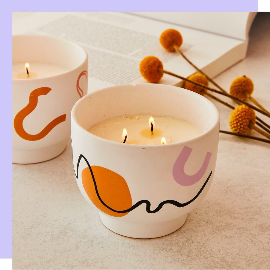 Bougies à 3 mèches allumées