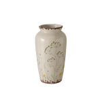 vase beige avec dessins floraux