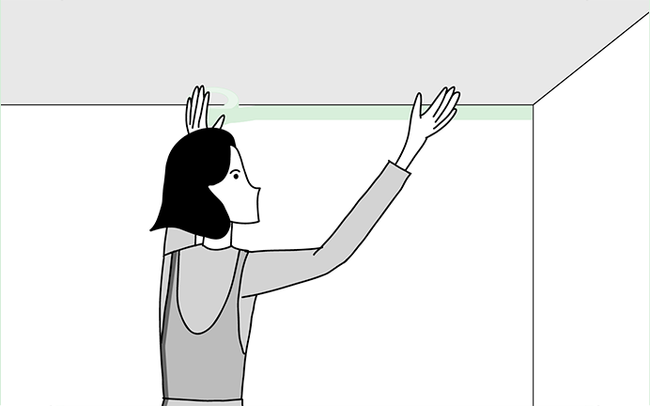 Dessin d'une personne appliquant du ruban de masquage vert au plafond