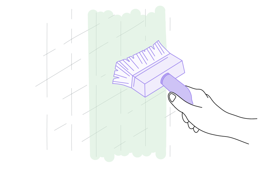 Dessin d'une main tenant une brosse pour appliquer de la colle au mur