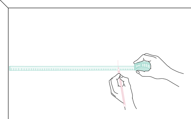 Dessin de mains mesurant et traçant des repères sur le mur