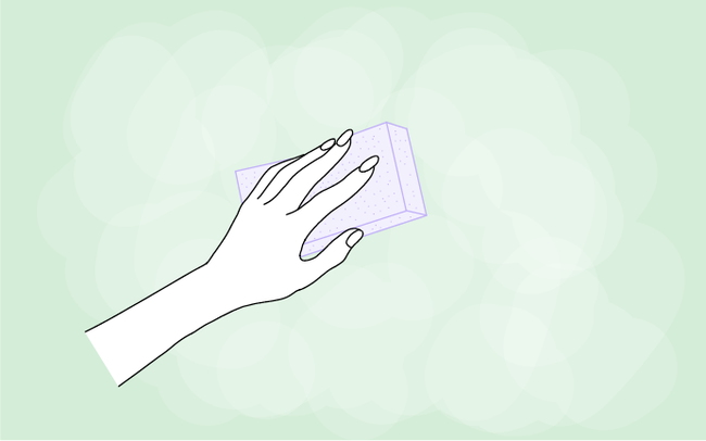 Dessin d'une main qui ponce un mur vert