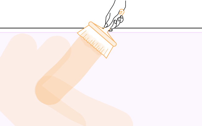 Dessin d'une main tenant une brosse pour déposer la colle sur le papier