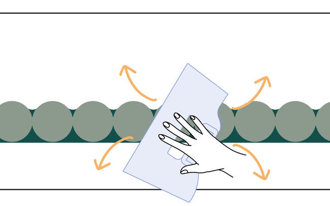 Dessin d'une main posant une frise au mur à l'aide d'une spatule à maroufler