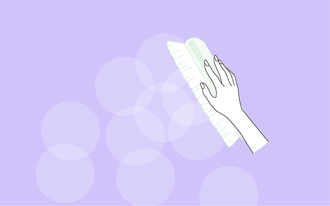 Dessin d'une main qui dépoussière un mur avec une brosse douce