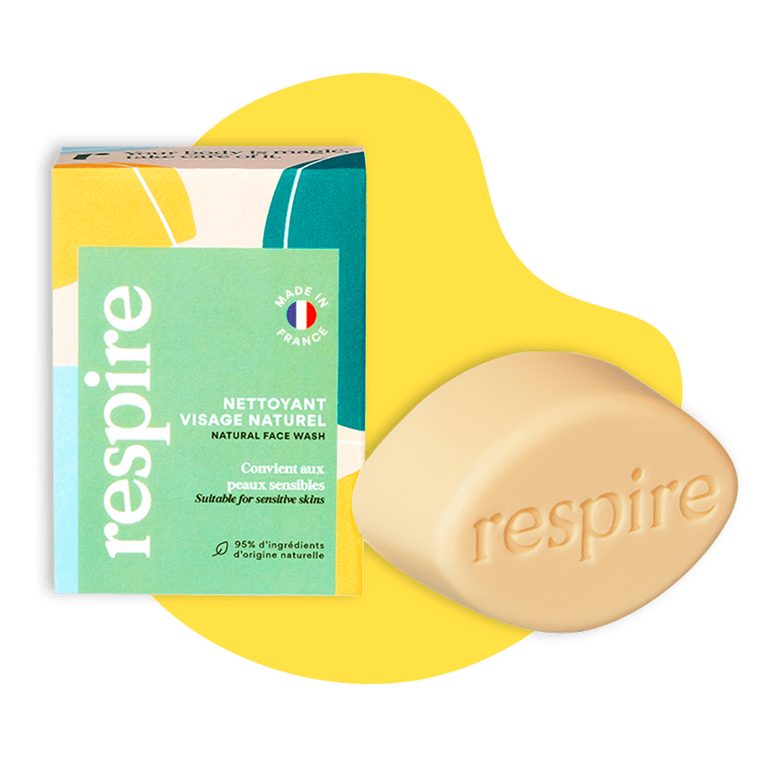  Soin solide nettoyant visage naturel de la marque Respire, forme jaune en fond