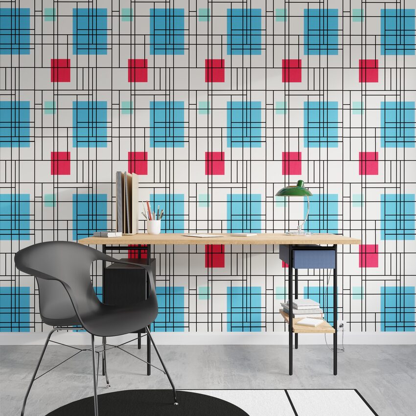 Papier peint à carrés rouge, bleu et bleu  avec des lignes noires dans un bureau design