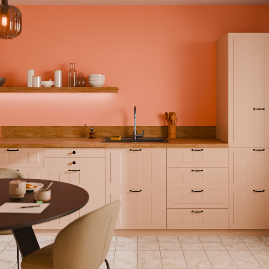 Ambiance cuisine couleur rose orangé, meubles beiges