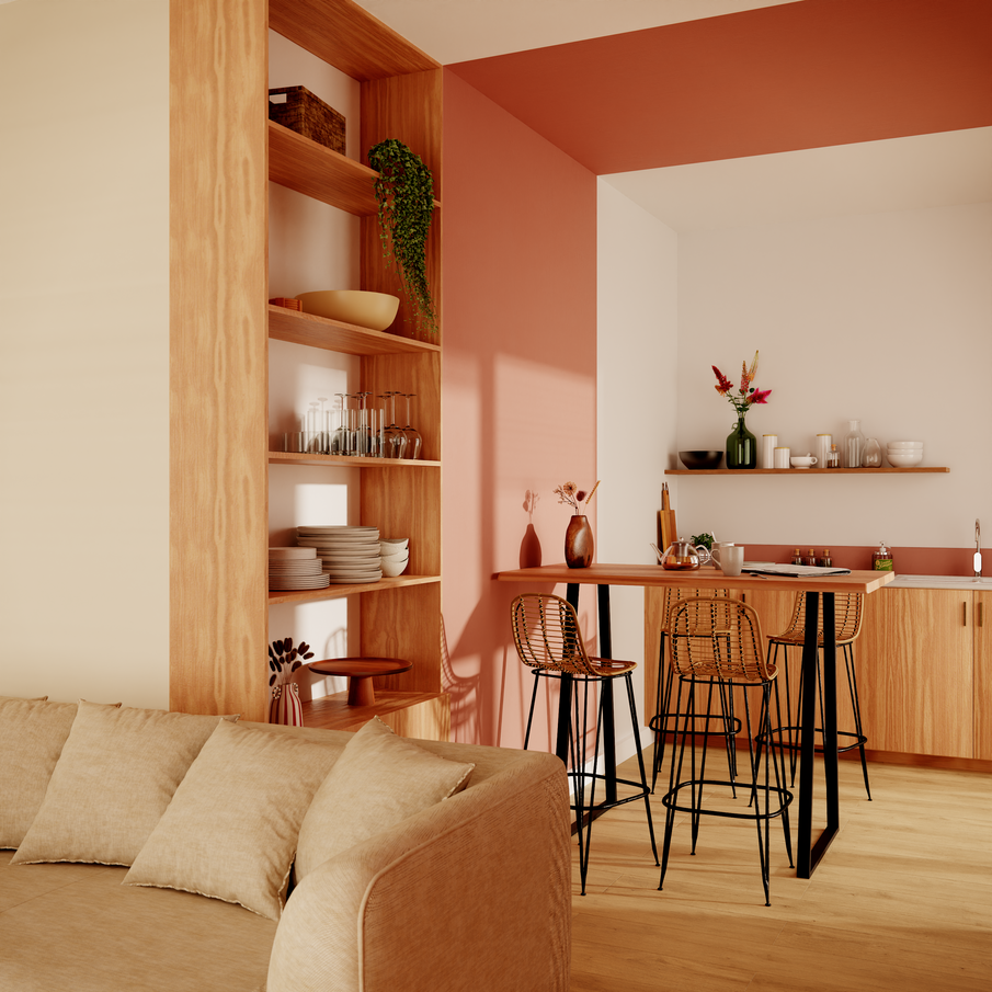 Cuisine ouverte avec coin repas démarqué par pan de mur et plafond peints en terracotta
