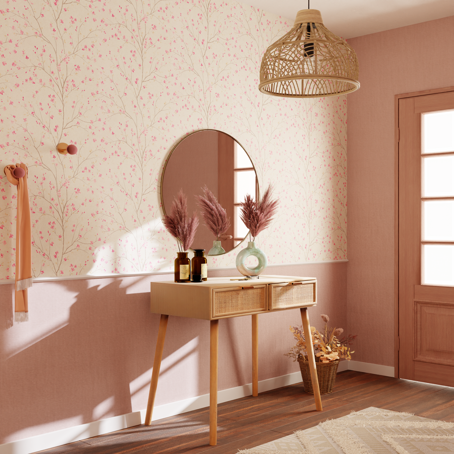 Console en bois et miroir rond dans une entrée au tons roses
