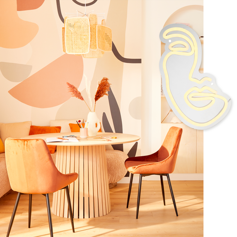 Néon mural visage en line-art proposé pour une salle à manger style scandinave