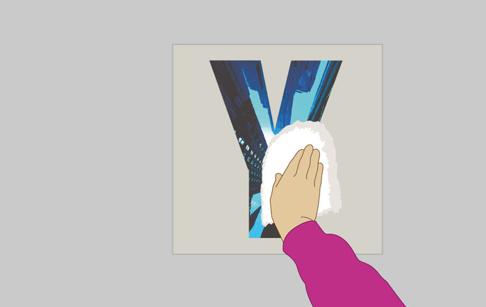 faire adhérer le sticker avec un chiffon